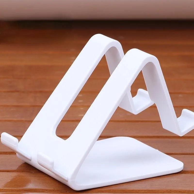 Soporte triangular universal para celular y tablet color blanco.