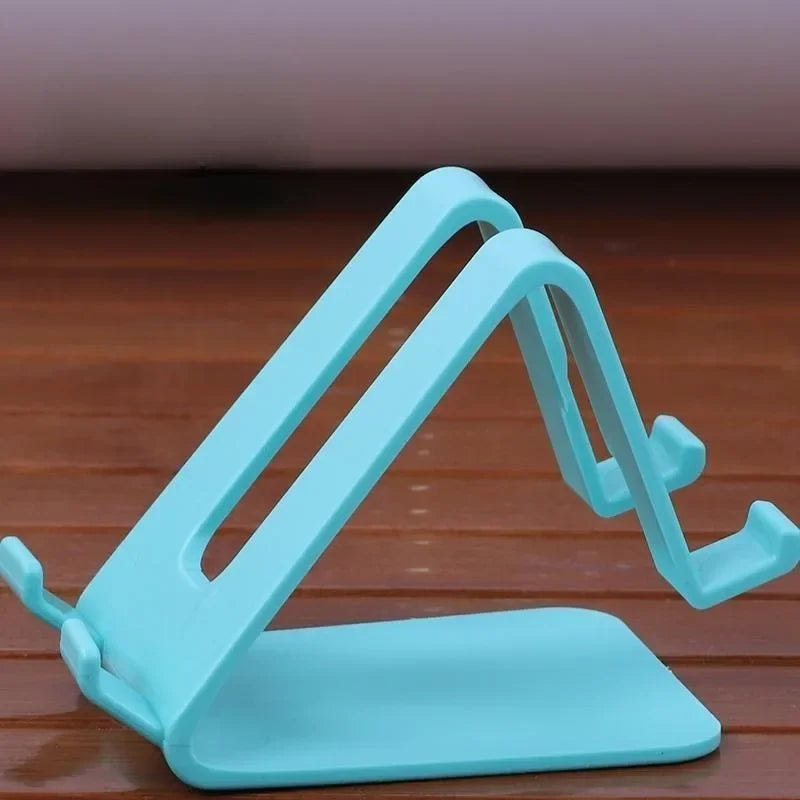 Soporte triangular universal para celular y tablet color verde claro.